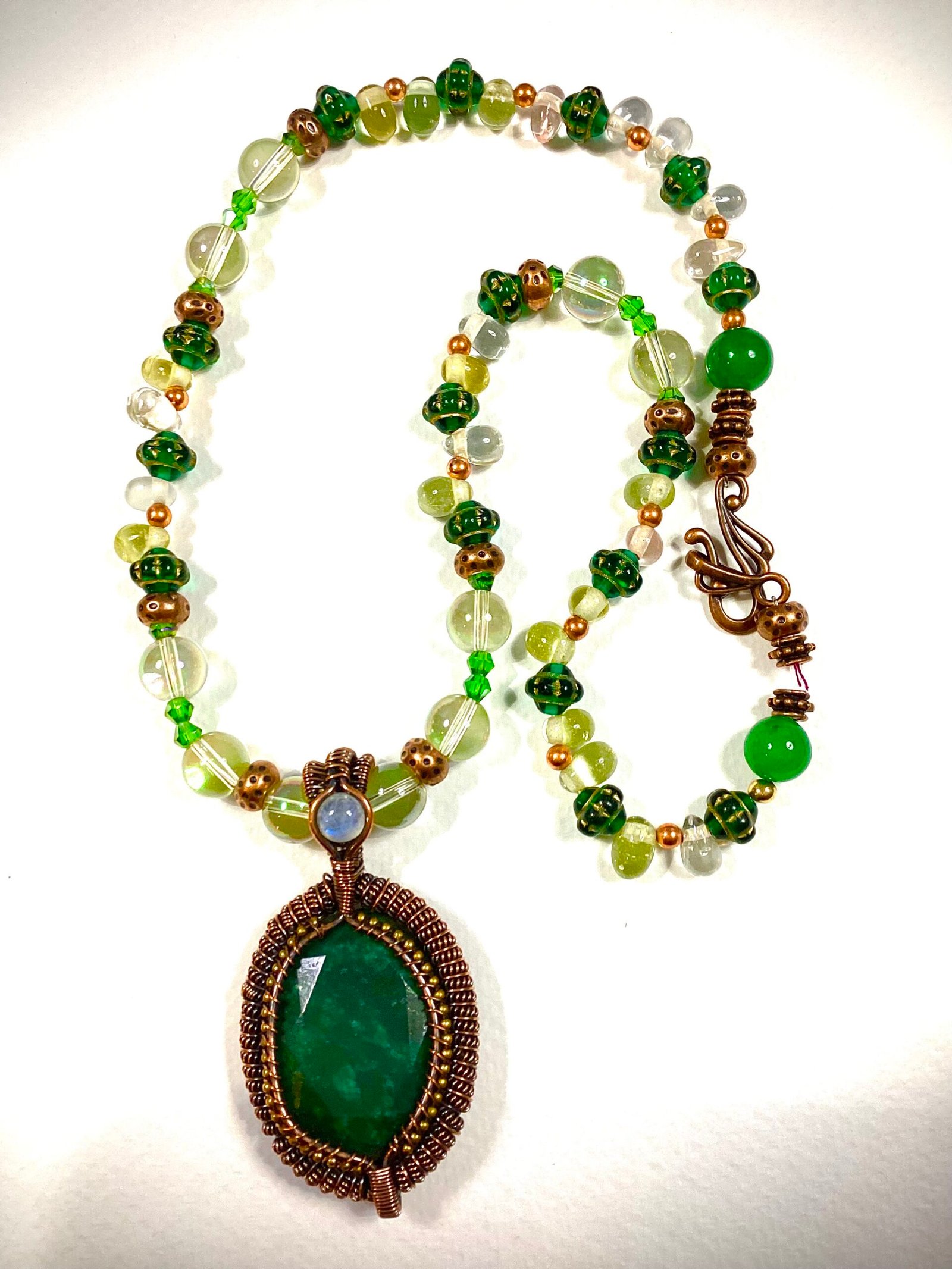 faceted emerald copper wrapped