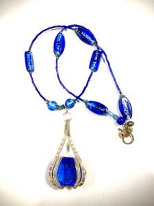 faceted sapphire in sterling wrap