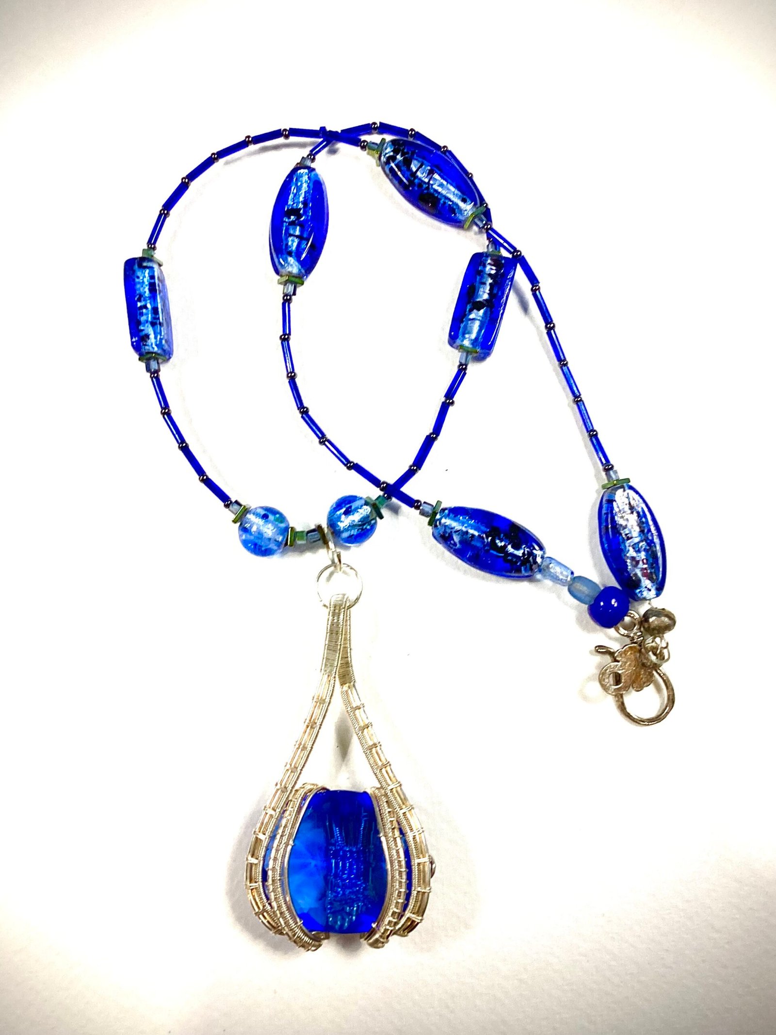 faceted sapphire in sterling wrap